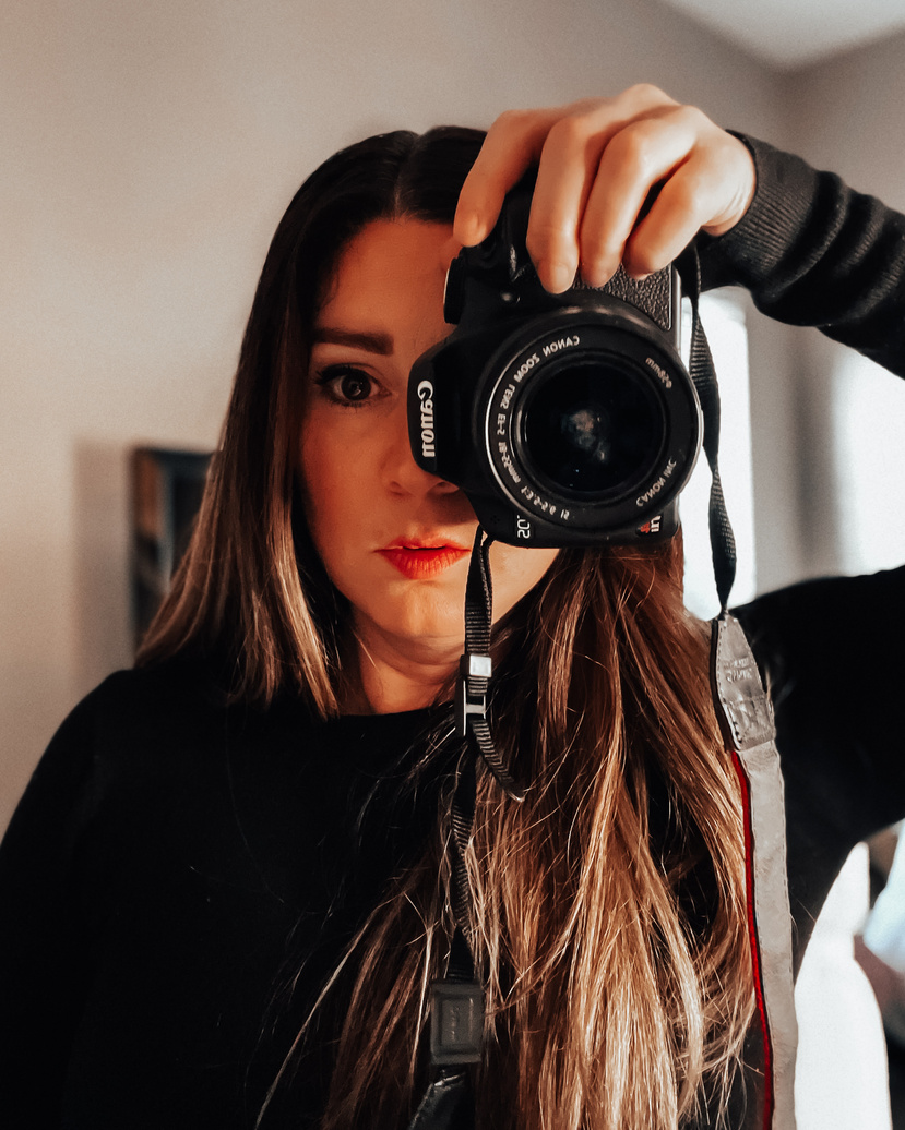 user generated content creator Jamie holding a Canon camera showing skills as a photographer